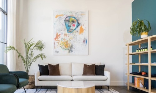 a room with a picture of a face on the wall